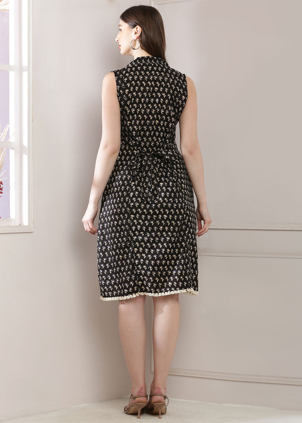Black Dress Featuring A Shirt Collar And A Stylish Belt